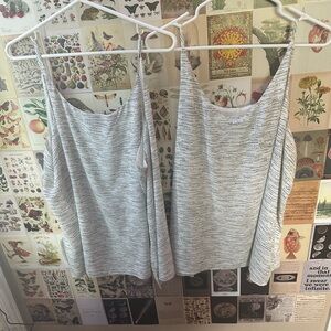 Reitman white shirt with black design. Size 2X sold separately.